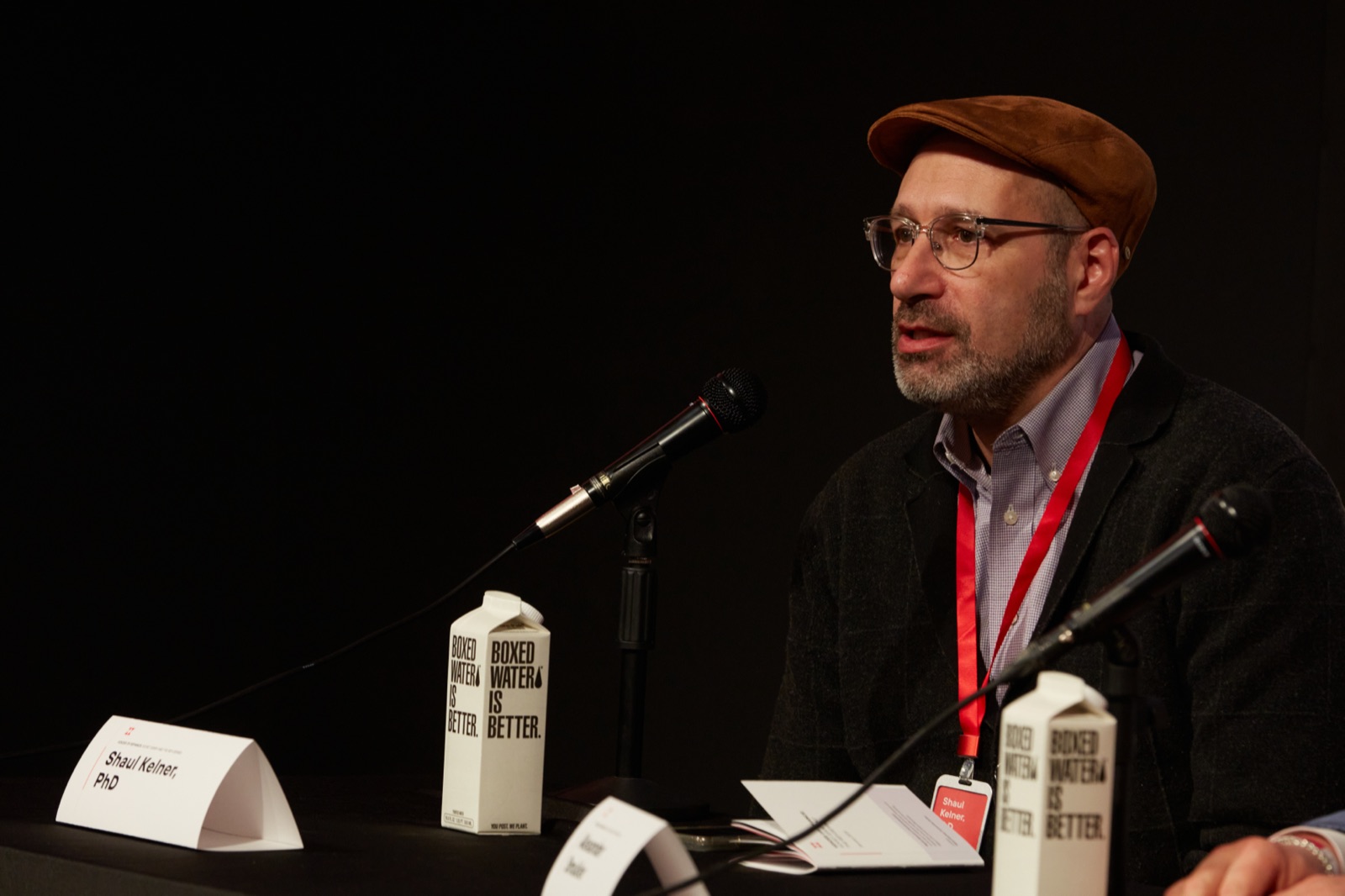 Shaul Kelner speaking at a panel discussion